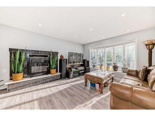 6408 Elbow Drive Sw, Calgary, AB - Indoor Photo Showing Living Room With Fireplace