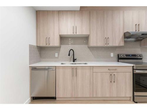 8315 Centre Street Nw, Calgary, AB - Indoor Photo Showing Kitchen With Double Sink