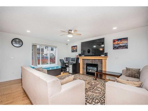 111 Covemeadow Court Ne, Calgary, AB - Indoor Photo Showing Living Room With Fireplace