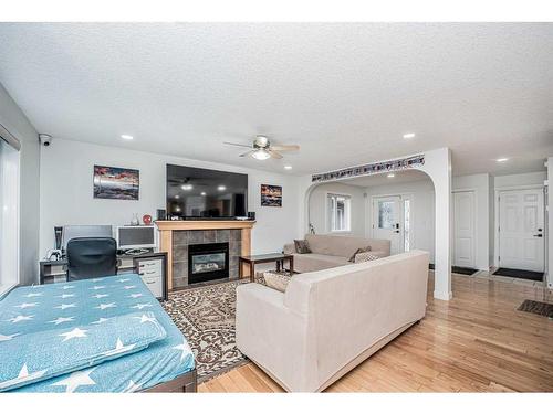 111 Covemeadow Court Ne, Calgary, AB - Indoor Photo Showing Living Room With Fireplace