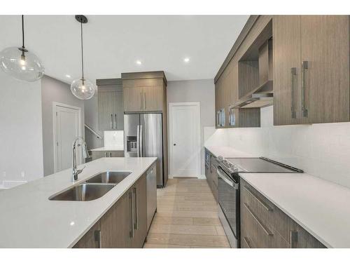 219 Dawson Wharf Rise, Chestermere, AB - Indoor Photo Showing Kitchen With Stainless Steel Kitchen With Double Sink With Upgraded Kitchen