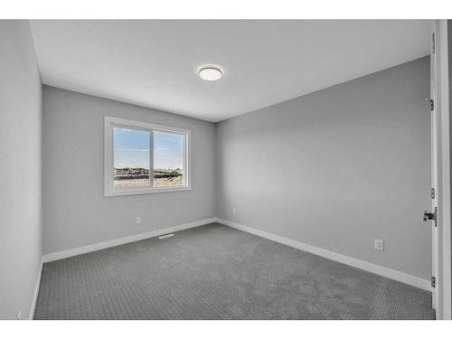 219 Dawson Wharf Rise, Chestermere, AB - Indoor Photo Showing Other Room