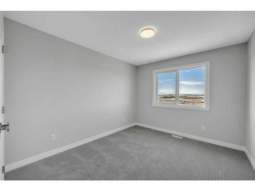 219 Dawson Wharf Rise, Chestermere, AB - Indoor Photo Showing Other Room