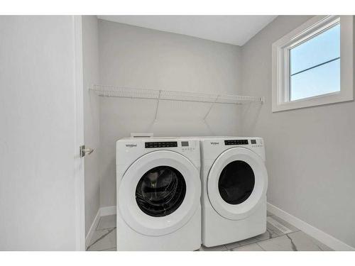 219 Dawson Wharf Rise, Chestermere, AB - Indoor Photo Showing Laundry Room