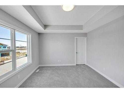 219 Dawson Wharf Rise, Chestermere, AB - Indoor Photo Showing Other Room