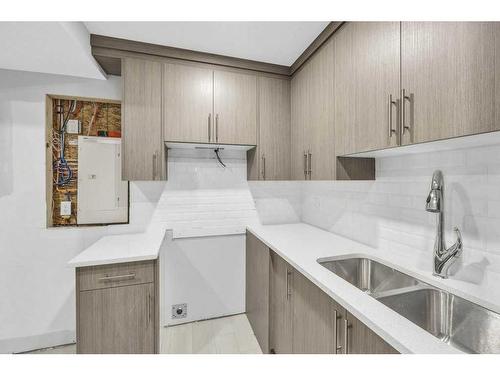 219 Dawson Wharf Rise, Chestermere, AB - Indoor Photo Showing Kitchen With Double Sink