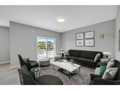 219 Dawson Wharf Rise, Chestermere, AB - Indoor Photo Showing Living Room