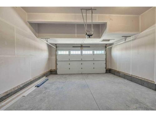 219 Dawson Wharf Rise, Chestermere, AB - Indoor Photo Showing Garage