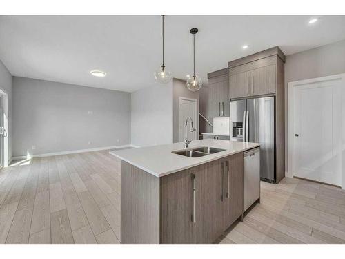 219 Dawson Wharf Rise, Chestermere, AB - Indoor Photo Showing Kitchen With Stainless Steel Kitchen With Double Sink With Upgraded Kitchen