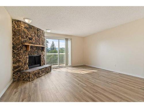 7008B Bowness Road Nw, Calgary, AB - Indoor With Fireplace