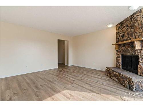 7008B Bowness Road Nw, Calgary, AB - Indoor With Fireplace