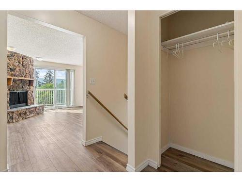 7008B Bowness Road Nw, Calgary, AB - Indoor Photo Showing Other Room With Fireplace