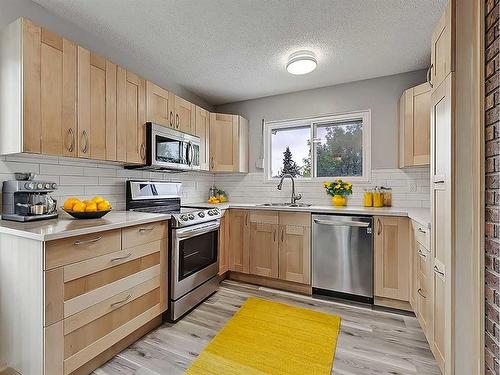 104 Oakfield Place Sw, Calgary, AB - Indoor Photo Showing Kitchen With Stainless Steel Kitchen