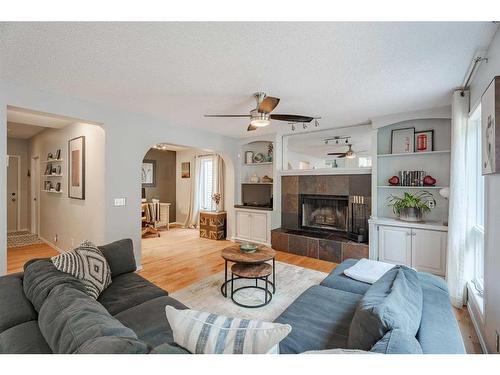 2745 Douglasdale Boulevard Se, Calgary, AB - Indoor Photo Showing Living Room With Fireplace