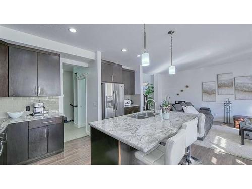 127 Evanswood Circle Nw, Calgary, AB - Indoor Photo Showing Kitchen With Stainless Steel Kitchen With Double Sink With Upgraded Kitchen