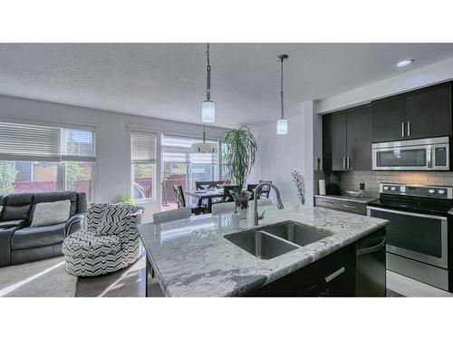 127 Evanswood Circle Nw, Calgary, AB - Indoor Photo Showing Kitchen With Stainless Steel Kitchen With Double Sink