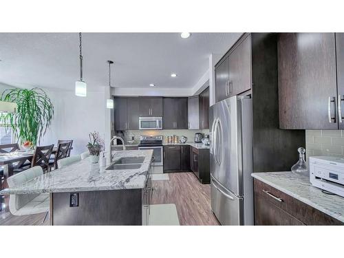 127 Evanswood Circle Nw, Calgary, AB - Indoor Photo Showing Kitchen With Stainless Steel Kitchen With Double Sink With Upgraded Kitchen