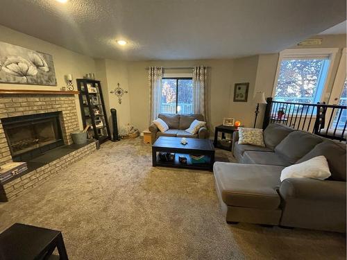 101 Riverglen Close Se, Calgary, AB - Indoor Photo Showing Living Room With Fireplace