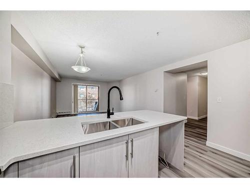 3203-16969 24 Street Sw, Calgary, AB - Indoor Photo Showing Kitchen With Double Sink