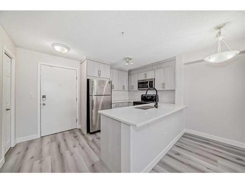 3203-16969 24 Street Sw, Calgary, AB - Indoor Photo Showing Kitchen With Double Sink With Upgraded Kitchen