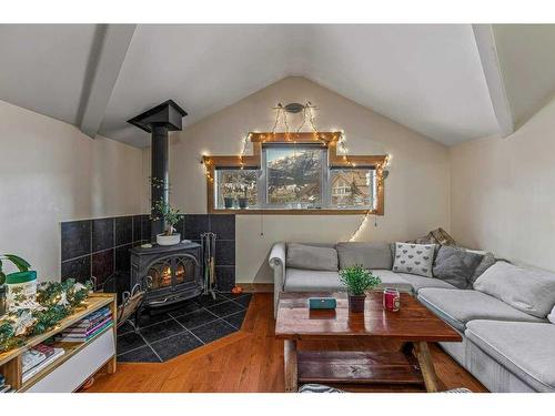 1275 Railway Avenue, Canmore, AB - Indoor Photo Showing Living Room With Fireplace