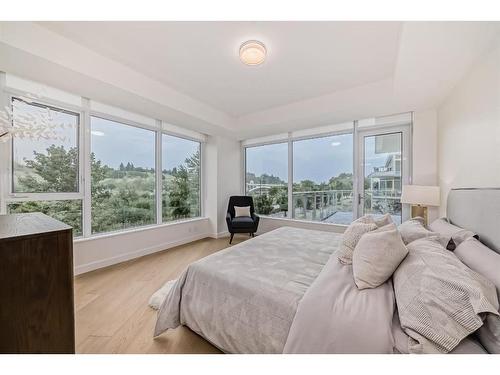 202-88 Waterfront Mews Sw, Calgary, AB - Indoor Photo Showing Bedroom