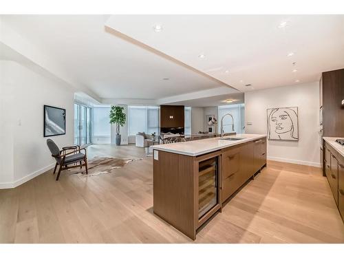 202-88 Waterfront Mews Sw, Calgary, AB - Indoor Photo Showing Kitchen With Double Sink