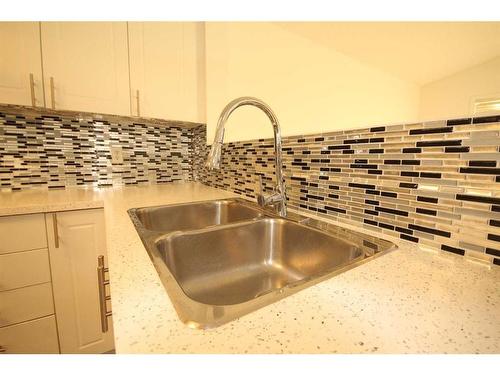 25 Martinvalley Road Ne, Calgary, AB - Indoor Photo Showing Kitchen With Double Sink