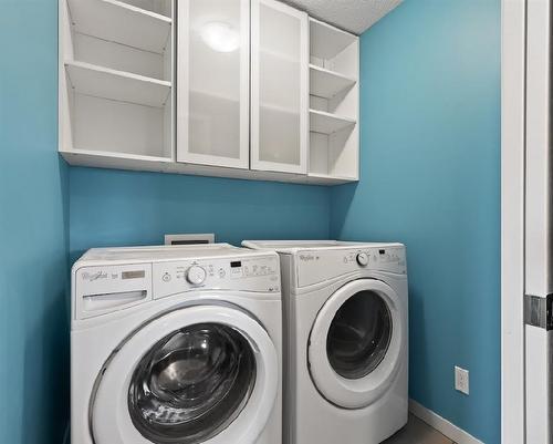 228 Cranarch Crescent Se, Calgary, AB - Indoor Photo Showing Laundry Room