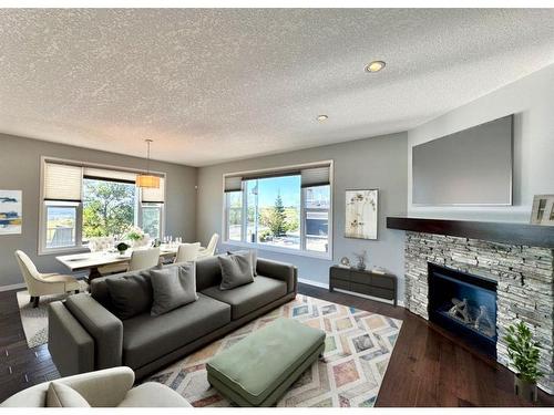 228 Cranarch Crescent Se, Calgary, AB - Indoor Photo Showing Living Room With Fireplace