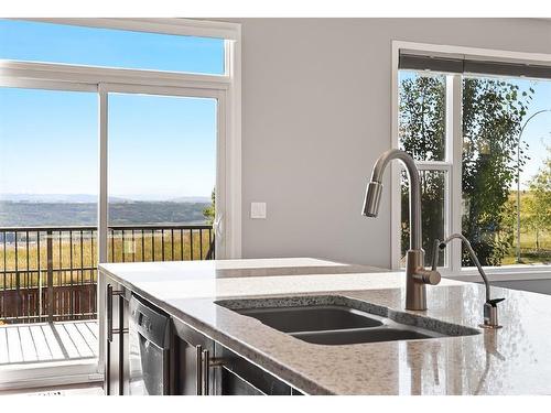 228 Cranarch Crescent Se, Calgary, AB - Indoor Photo Showing Kitchen With Double Sink