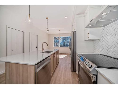 135 Edith Drive Nw, Calgary, AB - Indoor Photo Showing Kitchen With Double Sink With Upgraded Kitchen