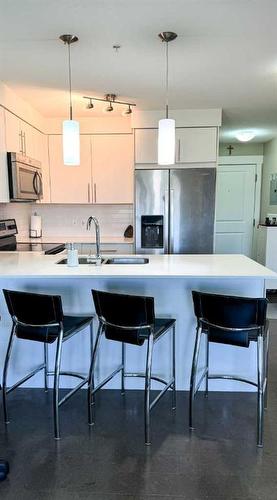 7310-302 Skyview Ranch Drive Ne, Calgary, AB - Indoor Photo Showing Kitchen With Stainless Steel Kitchen With Double Sink