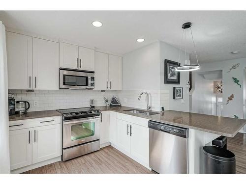 1410 Auburn Bay Square Se, Calgary, AB - Indoor Photo Showing Kitchen With Stainless Steel Kitchen With Double Sink With Upgraded Kitchen