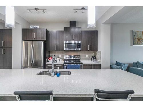 45 Legacy Glen Row Se, Calgary, AB - Indoor Photo Showing Kitchen With Upgraded Kitchen