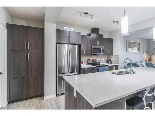 45 Legacy Glen Row Se, Calgary, AB - Indoor Photo Showing Kitchen With Double Sink With Upgraded Kitchen