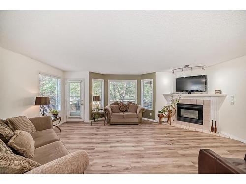 208 Scenic Acres Terrace Nw, Calgary, AB - Indoor Photo Showing Living Room With Fireplace