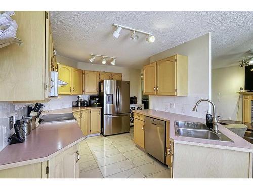 250 Coral Keys Court Ne, Calgary, AB - Indoor Photo Showing Kitchen With Double Sink