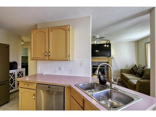 250 Coral Keys Court Ne, Calgary, AB - Indoor Photo Showing Kitchen With Double Sink