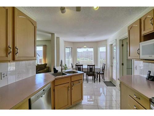 250 Coral Keys Court Ne, Calgary, AB - Indoor Photo Showing Kitchen With Double Sink