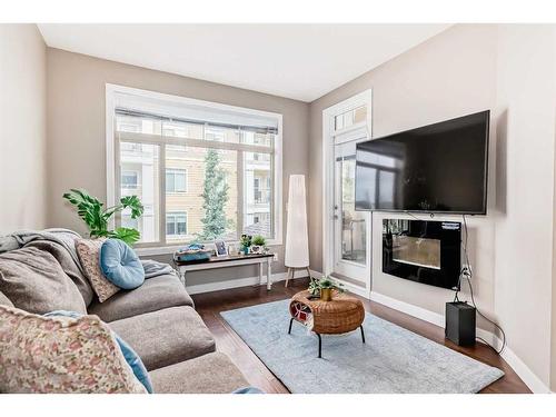 306-22 Auburn Bay Link Se, Calgary, AB - Indoor Photo Showing Living Room