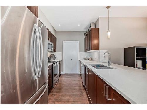 306-22 Auburn Bay Link Se, Calgary, AB - Indoor Photo Showing Kitchen With Stainless Steel Kitchen With Double Sink With Upgraded Kitchen