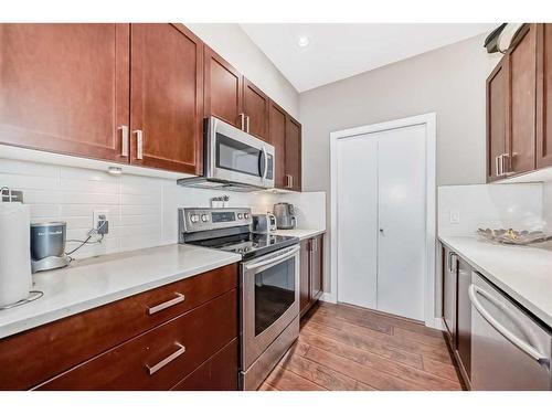 306-22 Auburn Bay Link Se, Calgary, AB - Indoor Photo Showing Kitchen With Stainless Steel Kitchen With Upgraded Kitchen