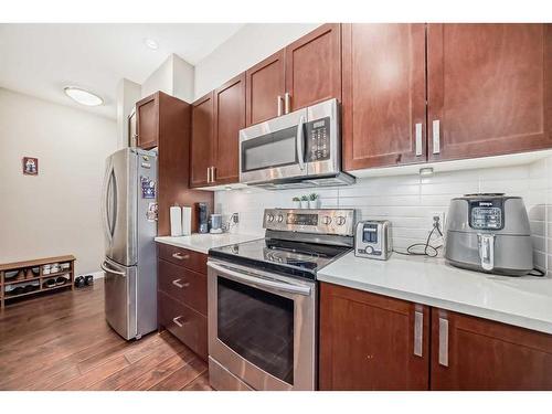 306-22 Auburn Bay Link Se, Calgary, AB - Indoor Photo Showing Kitchen With Stainless Steel Kitchen