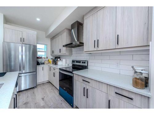 106-116 Saddlestone Heath Ne, Calgary, AB - Indoor Photo Showing Kitchen With Stainless Steel Kitchen