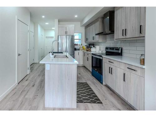 106-116 Saddlestone Heath Ne, Calgary, AB - Indoor Photo Showing Kitchen With Stainless Steel Kitchen