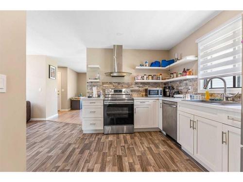 99 Abalone Way Ne, Calgary, AB - Indoor Photo Showing Kitchen With Double Sink