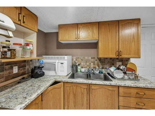 4 Tarington Link Ne, Calgary, AB - Indoor Photo Showing Kitchen With Double Sink