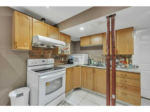 4 Tarington Link Ne, Calgary, AB - Indoor Photo Showing Kitchen With Double Sink