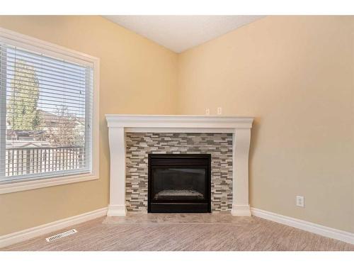 135 Kincora Drive Nw, Calgary, AB - Indoor Photo Showing Living Room With Fireplace